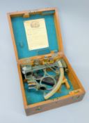 A boxed vintage sextant inscribed Groos Ltd London. The box 26.5 cm wide.
