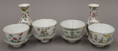 A pair Chinese famille rose porcelain vases and four Chinese porcelain lidded bowls.