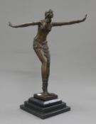 An Art Deco style bronze dancing girl. 42 cm high.