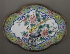 An early 20th century Canton enamel dish, decorated with a bird. 13.5 cm wide.