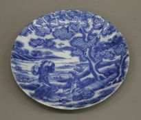 A Japanese blue and white porcelain scalloped dish. 21.5 cm diameter.