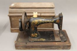 A vintage sewing machine, a vintage typewriter and a vintage mantle clock.