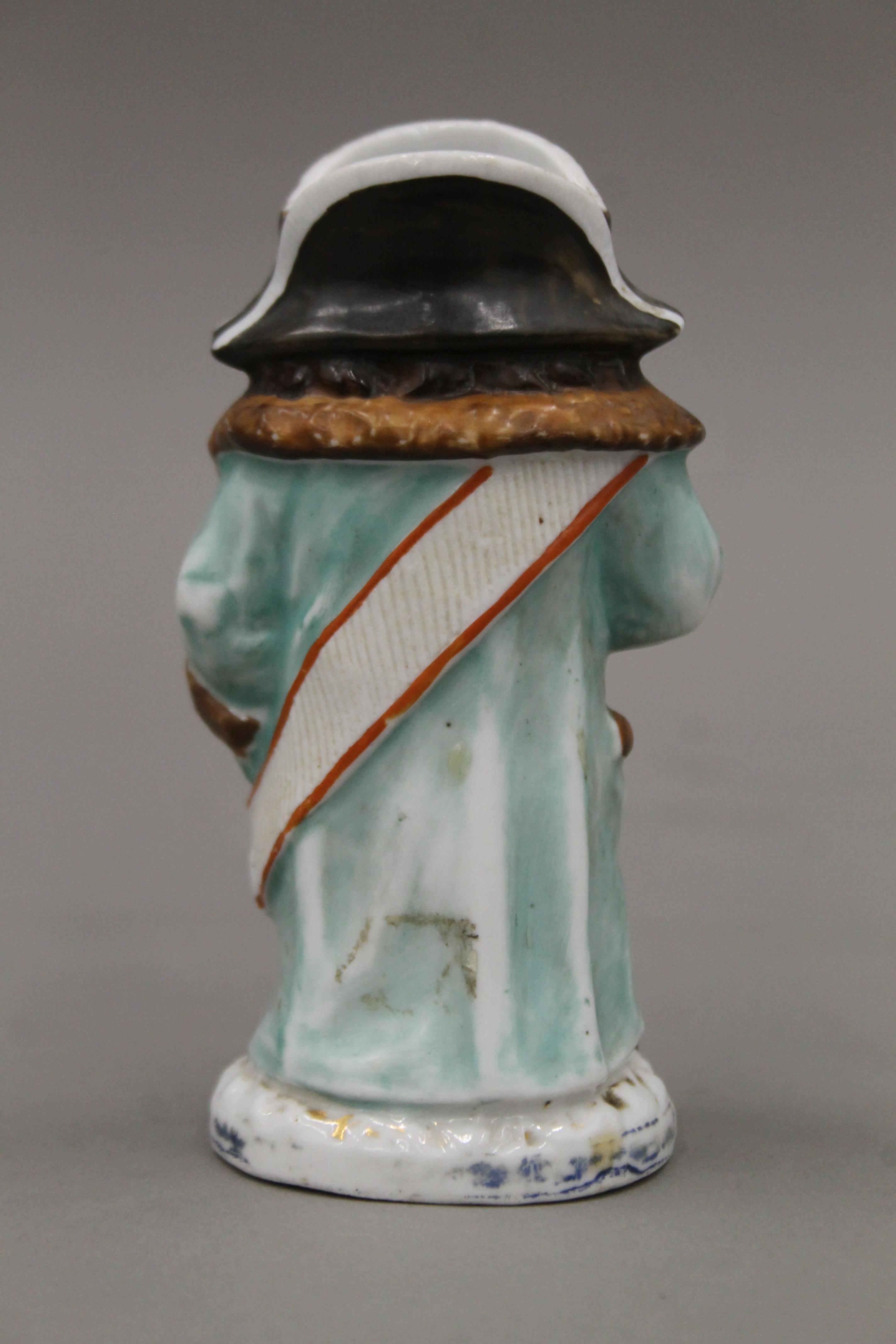 A Victorian porcelain match striker formed as Mr Bumble. 13 cm high. - Image 3 of 3