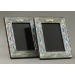 A pair of silver Art Nouveau style photograph frames.