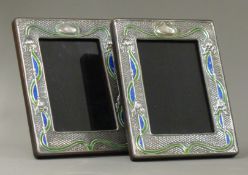 A pair of silver Art Nouveau style photograph frames.