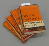 Four vintage motor manuals.