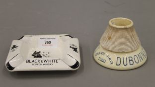 A Black and White Scotch Whisky ashtray and a Dubonnet Grand Prix 1900 table vesta match striker.