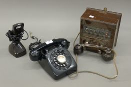 Three vintage telephones.