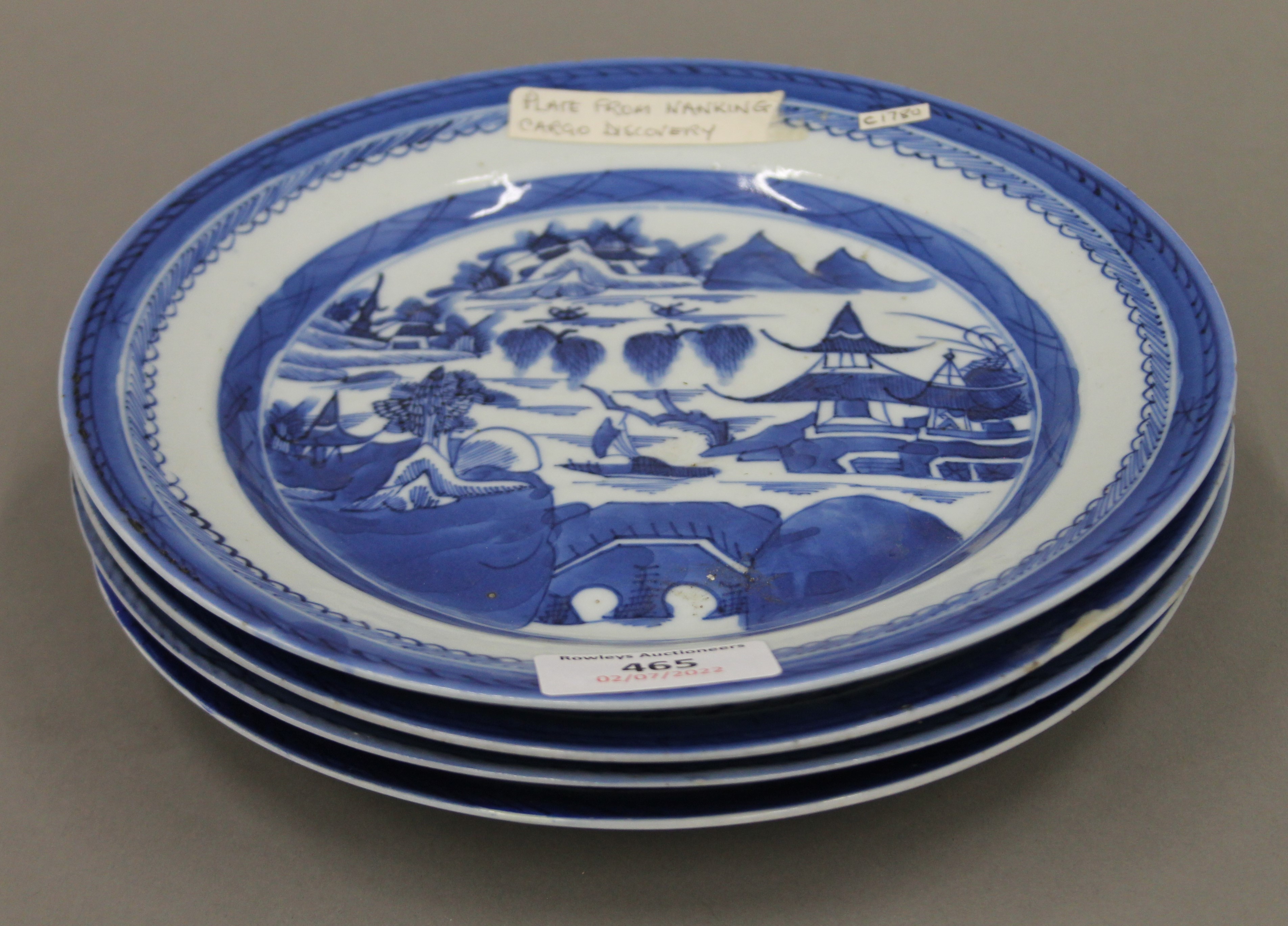 Four 18th century Chinese blue and white porcelain plates. Each approximately 21.5 cm diameter.