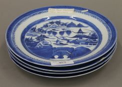 Four 18th century Chinese blue and white porcelain plates. Each approximately 21.5 cm diameter.