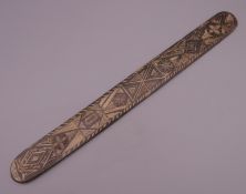 A carved baleen stay busk. 34 cm long.