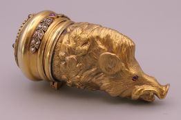 A diamond, ruby and sapphire set silver gilt box formed as boar's head, bearing Russian marks.