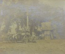 A framed photograph of steam engine and thresher. 37 x 30.5 cm overall.