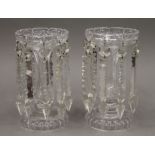 A pair of clear glass lustres. Each 23 cm high.