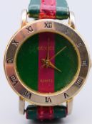 A Gucci ladies wristwatch. 2.5 cm diameter.