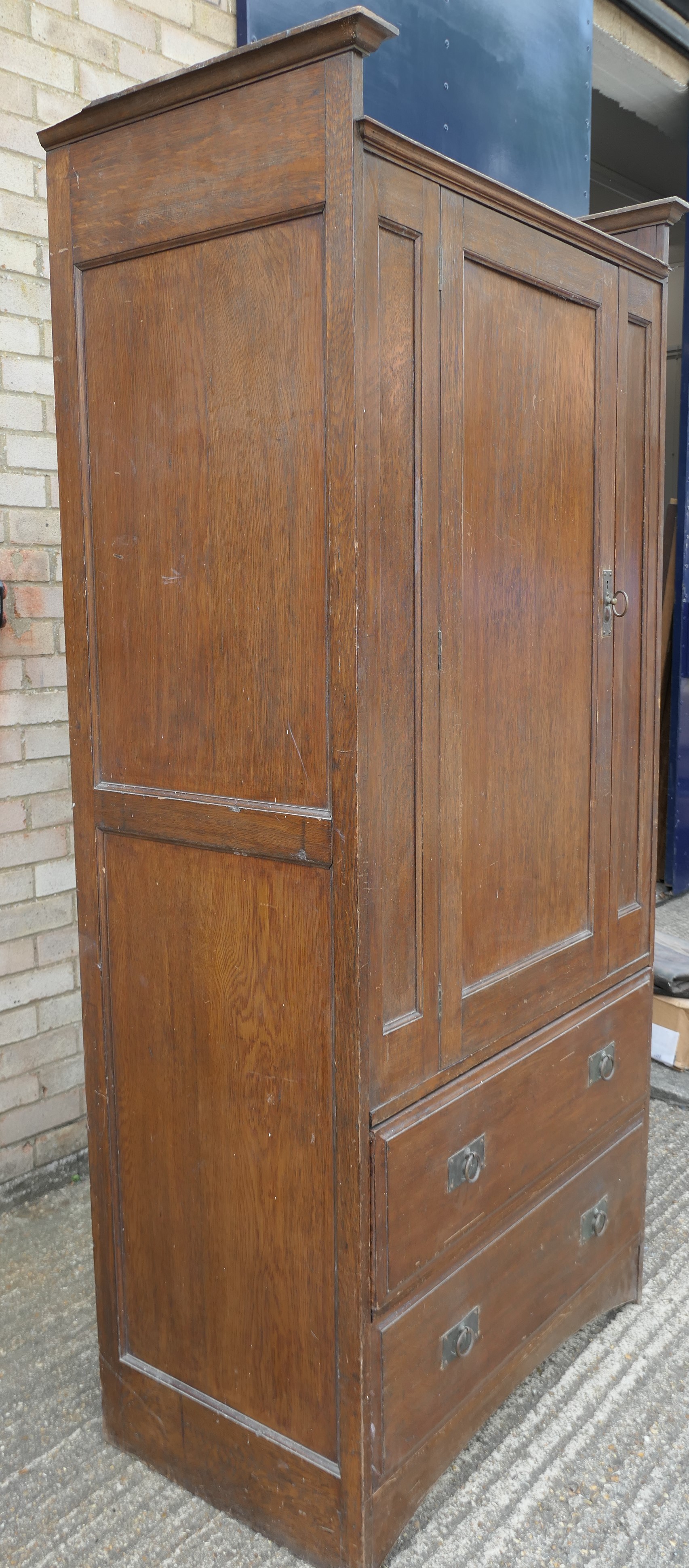 In the Manner of Heals, an Arts and Crafts oak compactum wardrobe. 199.5 cm high x 95 cm wide. - Image 7 of 11