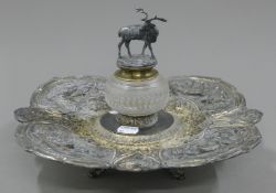 A silver plated deer topped inkwell.