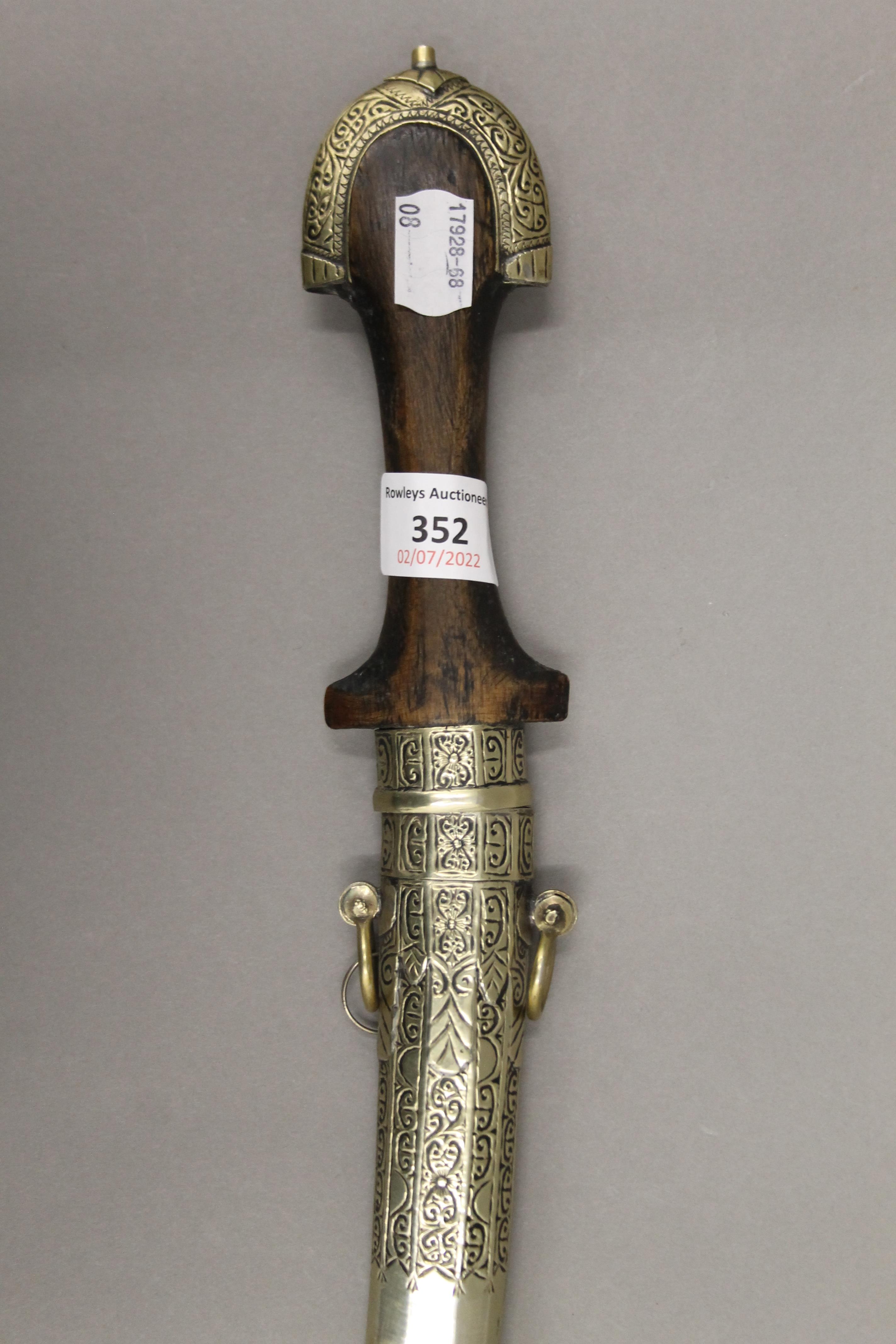 An Eastern Jambiya in scabbard. 40 cm long. - Image 2 of 3