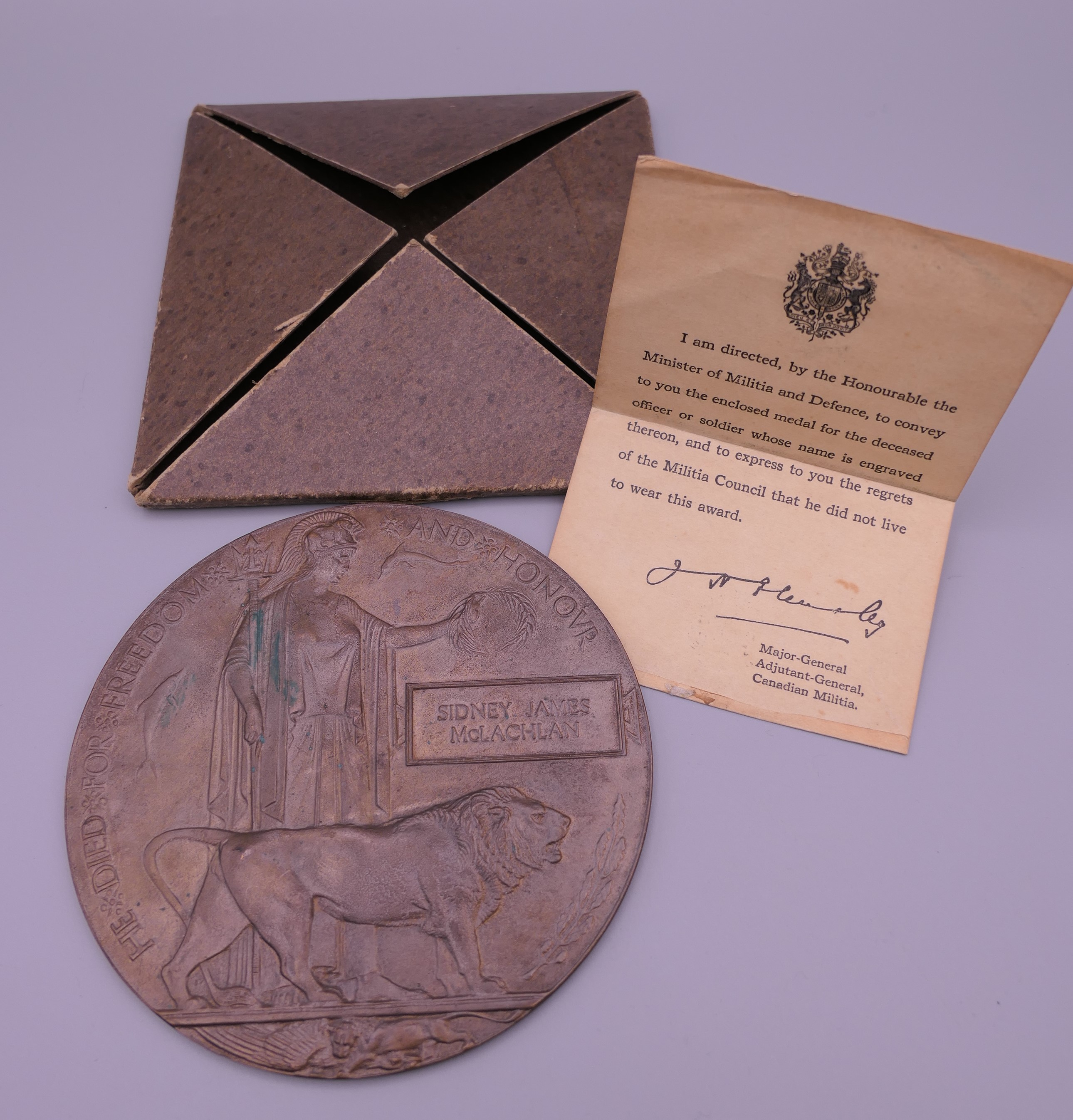 A Canadian WWI memorial death plaque for Sidney James McLachlan. 12 cm diameter.