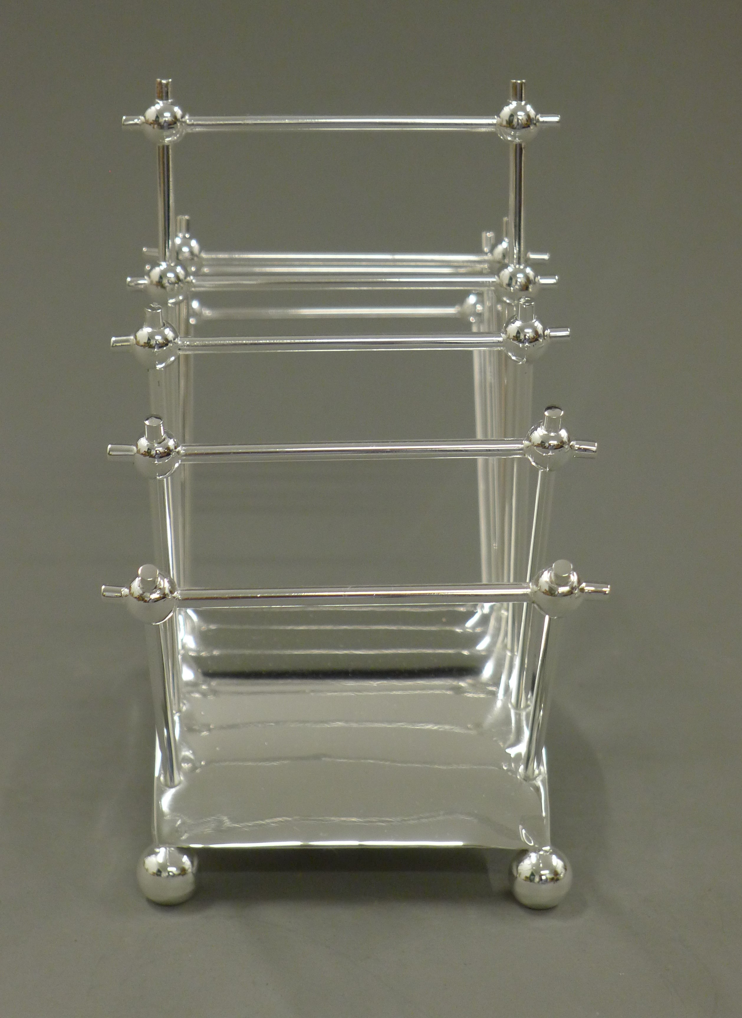 A Christopher Dresser style silver plated toast rack. 22 cm long. - Image 3 of 3
