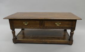 A modern oak two-drawer coffee table. 112 cm long, 55 cm deep, 46 cm high.