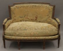 A 19th century upholstered settee. 130 cm wide.