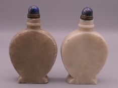 Two lapiz top snuff bottles. Approximately 10 cm high.