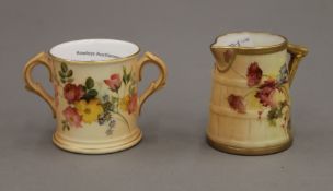 A Royal Worcester jug and a Royal Worcester two handled cup. The former 6 cm high.