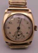 A 9 ct gold cased Rolex Tudor wristwatch, mounted on a later strap. 3 cm wide.