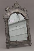 An 18th/19th century pewter clad strut mirror. 41.5 cm high.