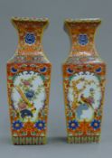 A pair of Chinese porcelain vases decorated with flowers and birds. 25 cm high.