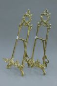 A pair of brass table easels. Each 51 cm high.