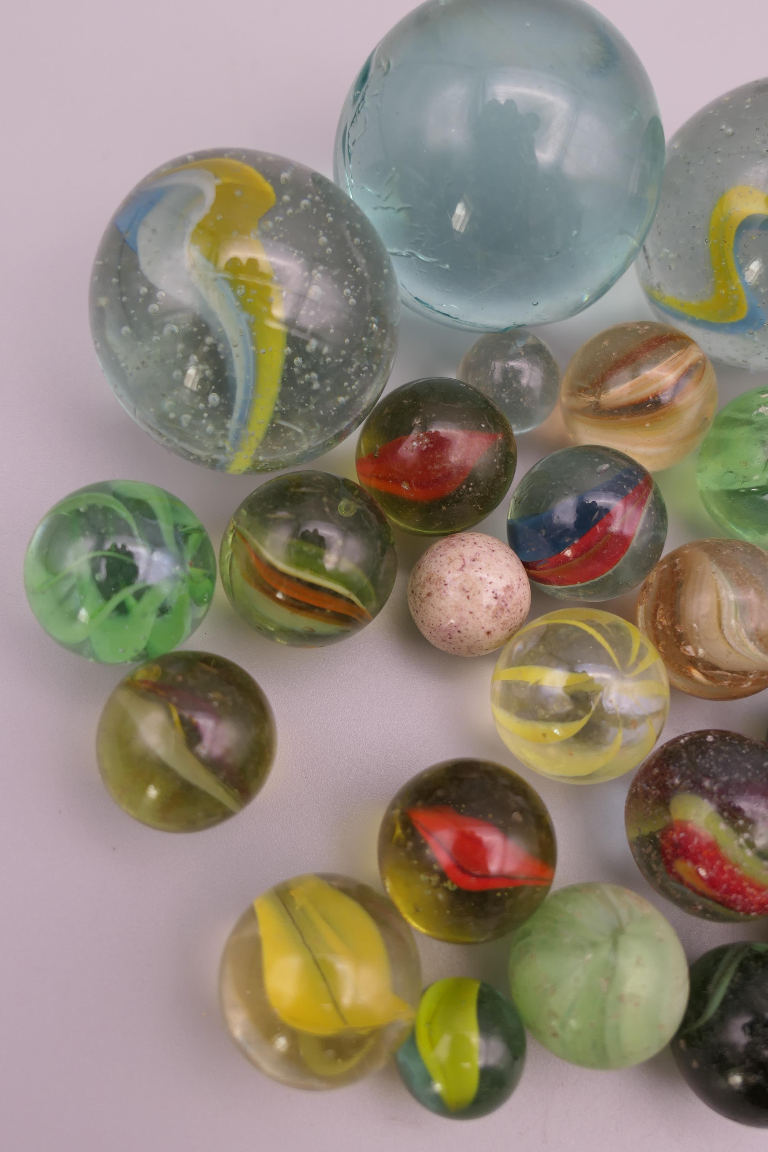 Four antique glass marbles (three approximately 1 inch diameter and the other 15/16th of an inch - Image 2 of 14