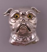 A silver brooch formed as a dog. 3 cm high.