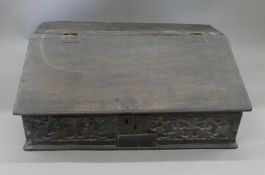 A 17th century oak bible box. 69 cm wide.