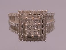 A 14 K white gold diamond ring. Ring size S/T. 12.6 grammes total weight.