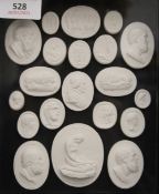 Twenty framed Grand Tour type plaster intaglios, mounted in a box frame. 28 x 31.5 cm overall.