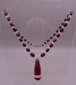 A vintage Czechoslovakian facet cut red and clear glass necklace.