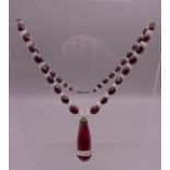 A vintage Czechoslovakian facet cut red and clear glass necklace.