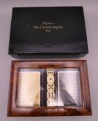 A boxed Van Cleef and Arples gaming set including two packs of cards and five dice. Box 19 x 13 cm.
