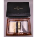 A boxed Van Cleef and Arples gaming set including two packs of cards and five dice. Box 19 x 13 cm.