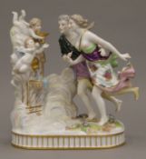 A Continental porcelain figural group. 19 cm high.