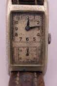 A vintage Art Deco wristwatch. 2 cm wide.