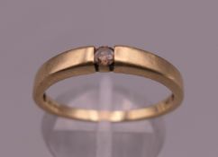 A 9 ct gold diamond solitaire ring. Ring size R/S. 2.2 grammes total weight.