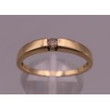 A 9 ct gold diamond solitaire ring. Ring size R/S. 2.2 grammes total weight.