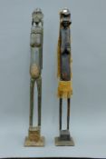 Two Tribal carved wooden fertility figures. The largest 100 cm high.