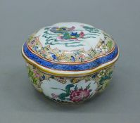 A Sampson box decorated with Mandarin Ducks and flowers. 8 cm high.