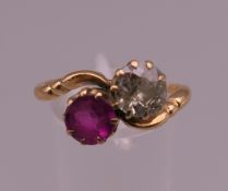 An antique 18 ct gold ruby and diamond crossover ring. Ring size U. 4.2 grammes total weight.