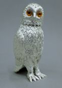 A silver plated sugar sifter formed as an owl. 15 cm high.