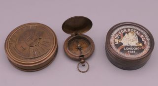 Three compasses. The largest 7.5 cm diameter.
